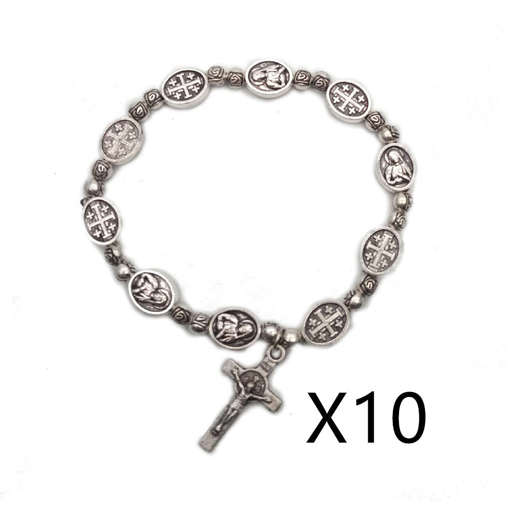 Rose colored beads strung in rosary pattern with Madonna centerpiece