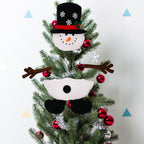 Holiday decoration featuring multiple cloth ornament styles