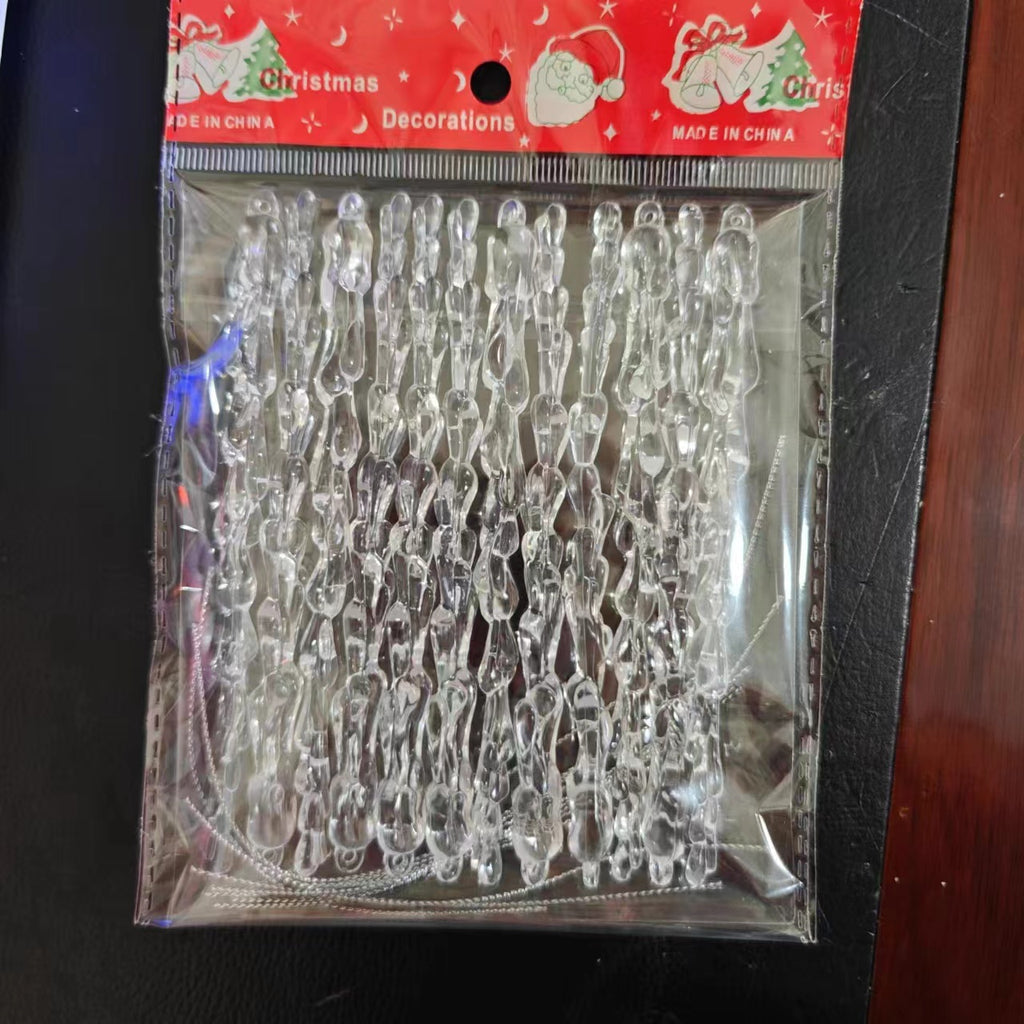 Transparent festive pendants displayed against a winter-themed backdrop