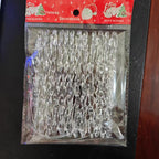 Transparent festive pendants displayed against a winter-themed backdrop