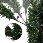 Assembled green artificial Christmas tree with berry and cone decorations in a decorated room