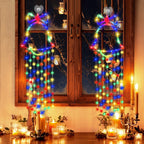 White bell hanging lamp with small glowing balls creating warm Christmas ambiance