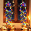 White bell hanging lamp with small glowing balls creating warm Christmas ambiance