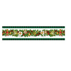 Festive Christmas table runner set on decorated holiday table with candles and greenery