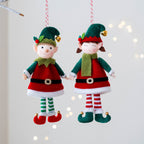 Two Christmas elf doll pendants displayed together, boy and girl variants