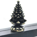 Cheerful metal snowman ornament with brass hinge detail for Christmas display