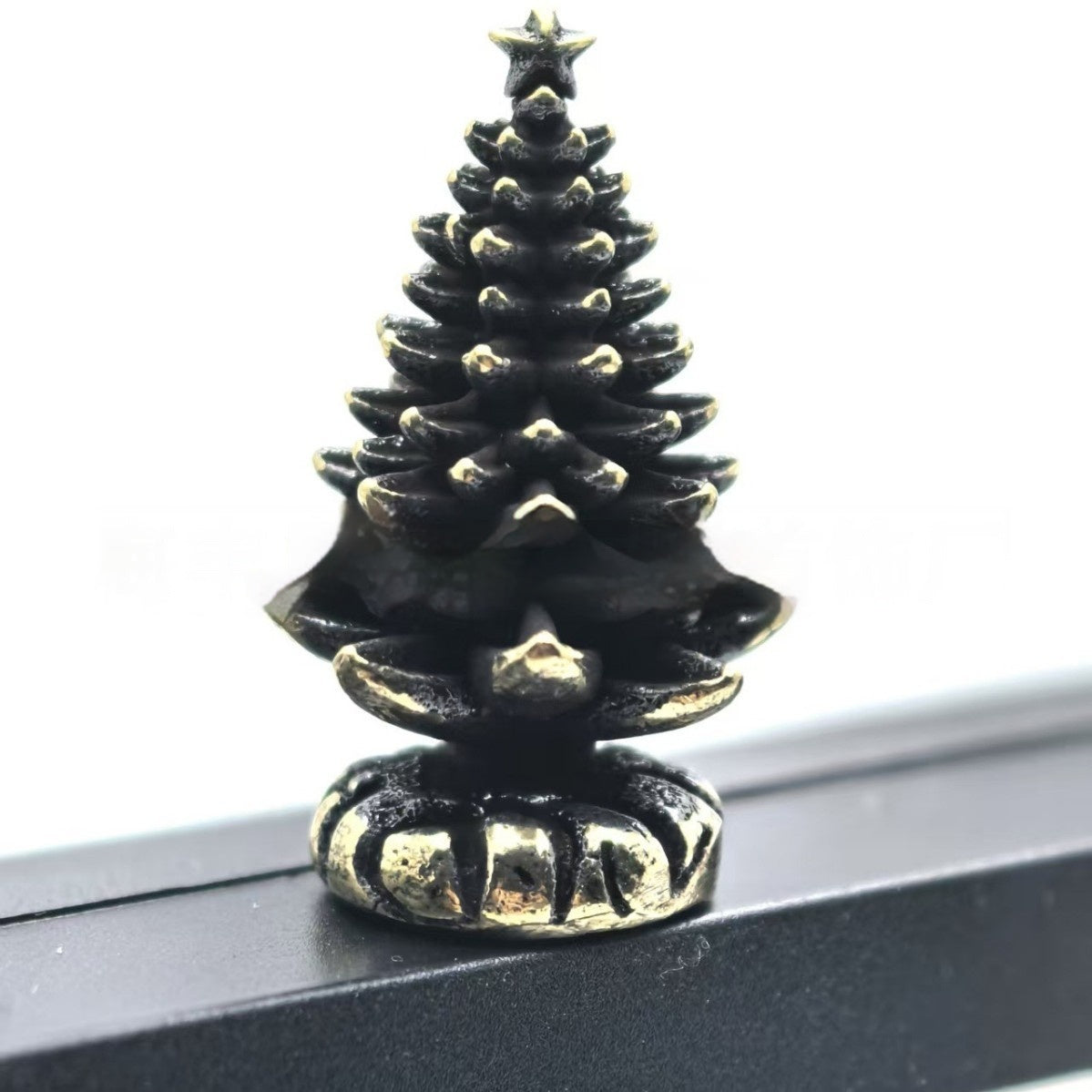 Cheerful metal snowman ornament with brass hinge detail for Christmas display