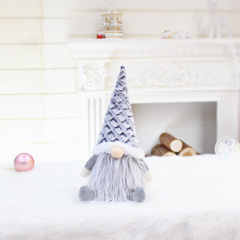 Faceless doll Christmas decoration in window scene setting