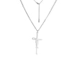 Gold tone Jesus cross pendant necklace displayed on white background
