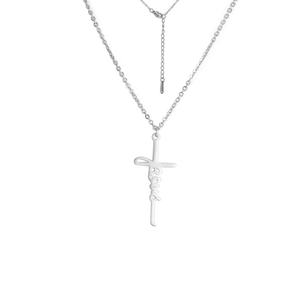 Gold tone Jesus cross pendant necklace displayed on white background