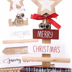 Wood Christmas tree letter decoration displayed on rustic shelf with warm lighting
