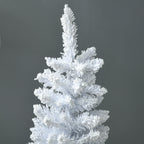White pencil Christmas tree standing next to a fireplace with holiday decorations