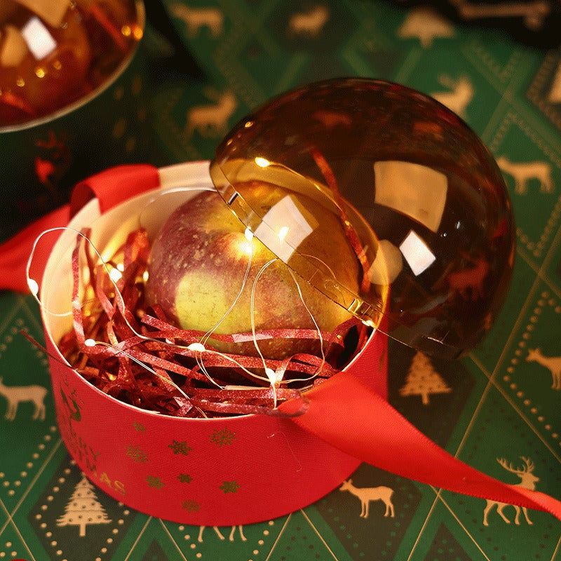 Christmas acrylic gift box in red and green colors displayed on festive table