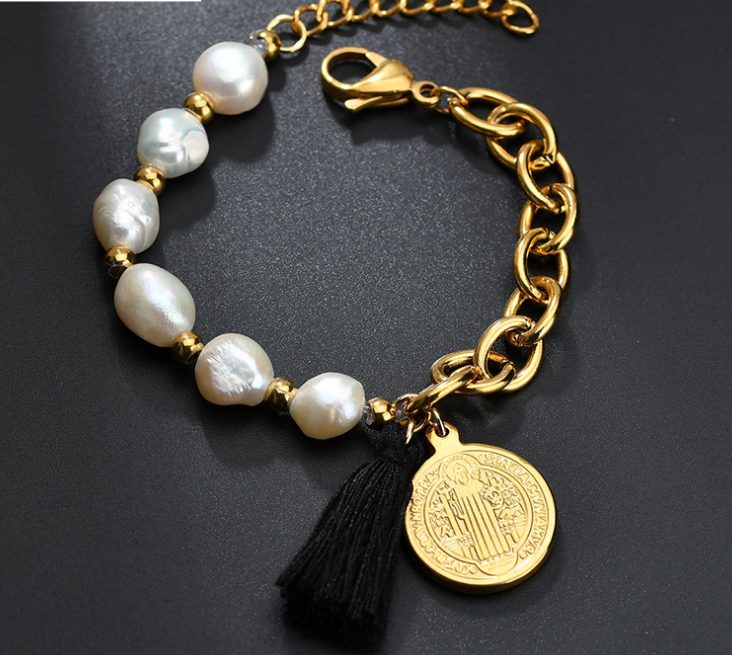 Jesus pendant on stainless steel bracelet close-up