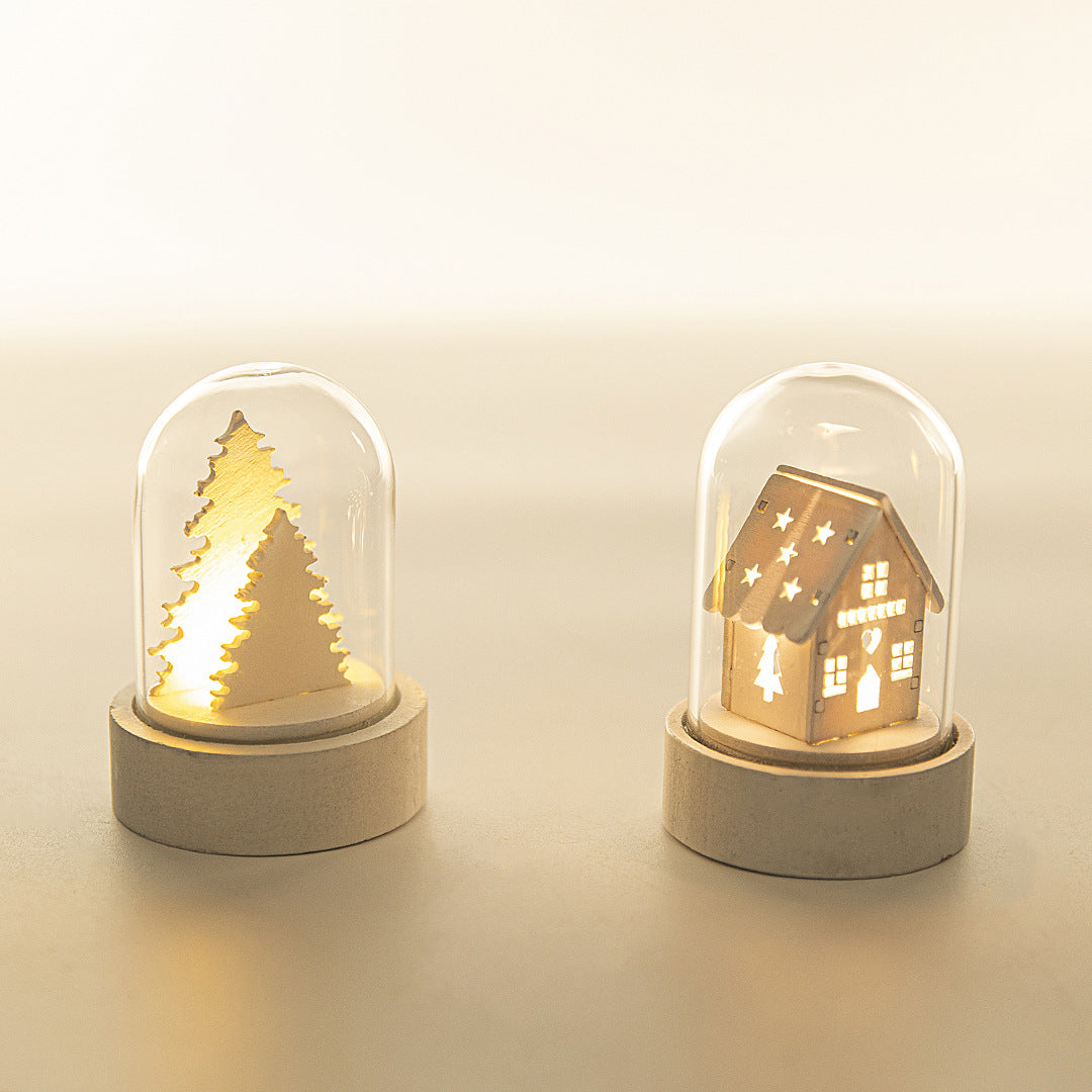 Stack of wooden house Christmas ornaments in tree and cottage styles