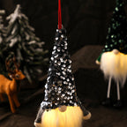 Glowing Christmas doll displayed on festive surface