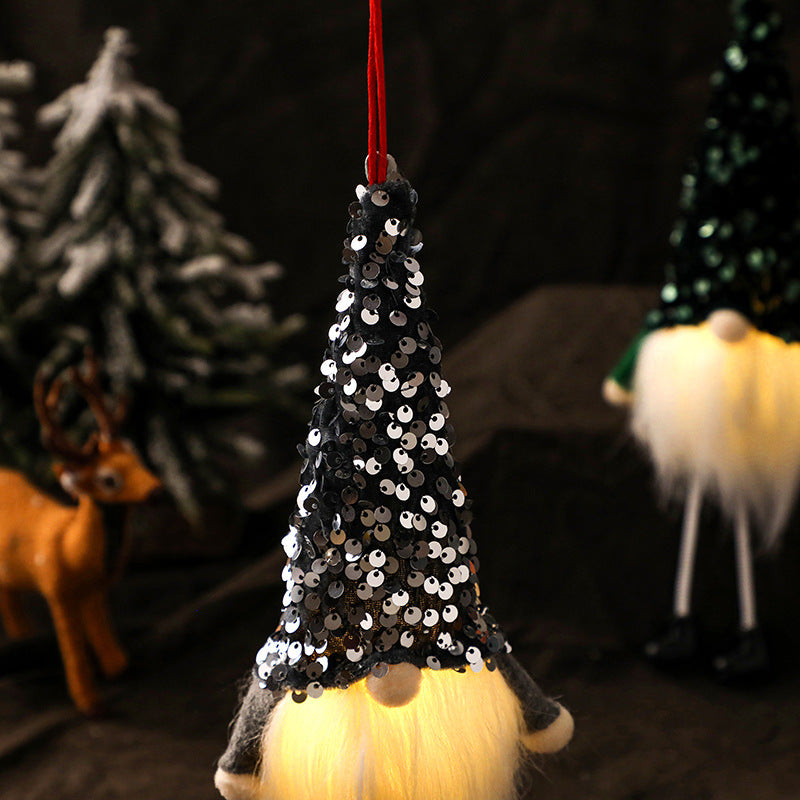 Glowing Christmas doll displayed on festive surface