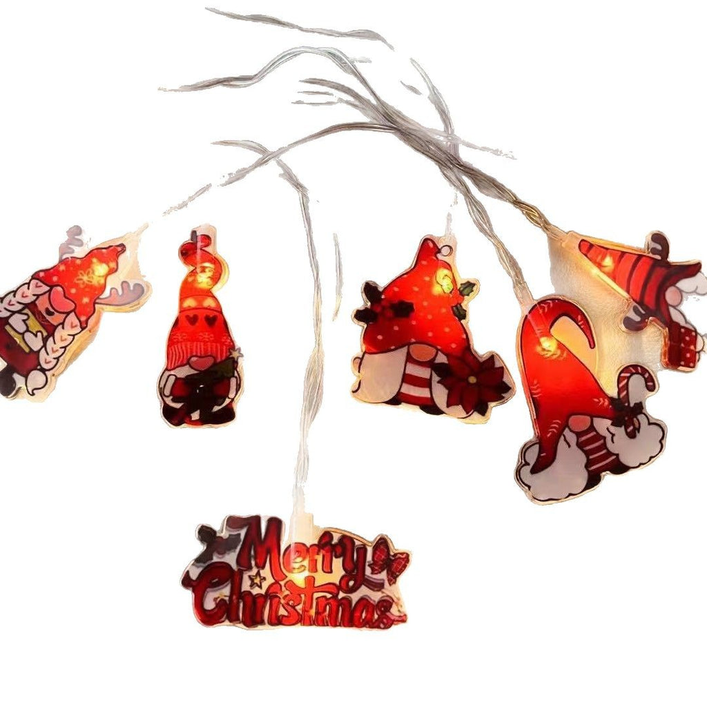 Festive Christmas tree string lights illuminating cozy holiday scene