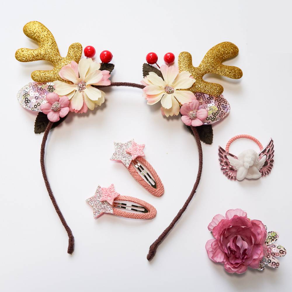 Festive Christmas hair band and clip set arranged for display with holiday styling