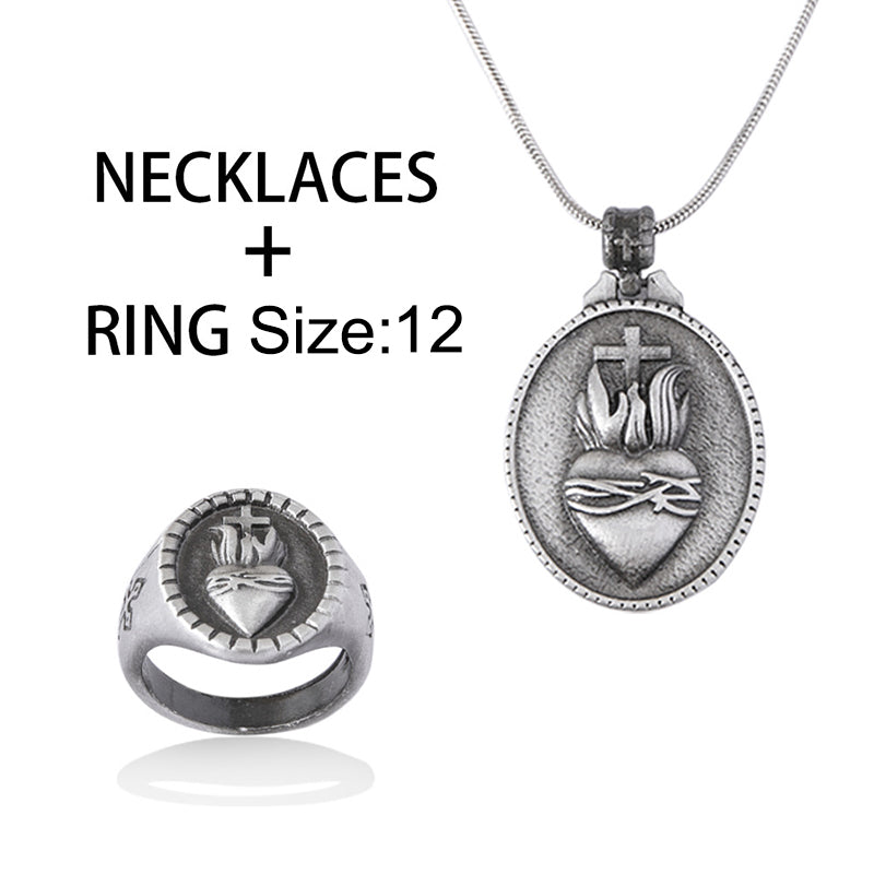 Close-up of heart and cross pendant on snake chain in vintage style zinc alloy
