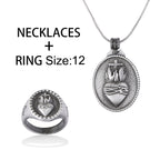 Close-up of heart and cross pendant on snake chain in vintage style zinc alloy
