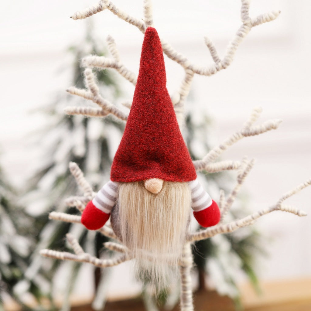 Holiday fabric pendant featuring charming faceless doll design