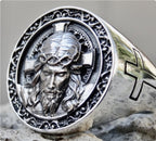 Jesus cross ring displayed flat against a surface showing the detailed cross motif