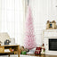 7ft pink snow-flocked pencil Christmas tree in a cozy living room setting