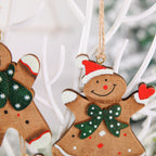 Variety of four wooden gingerbread man ornaments in different festive styles