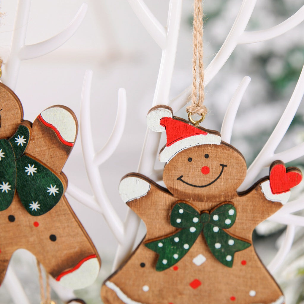 Variety of four wooden gingerbread man ornaments in different festive styles