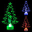 Colorful glowing Christmas tree ornament with automatic color-changing light displayed against a festive background