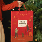 Flat-packed Christmas gift box ready for folding and assembly