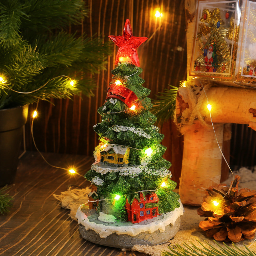 Resin Christmas tree ornament glowing softly in warm light