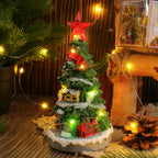 Resin Christmas tree ornament glowing softly in warm light