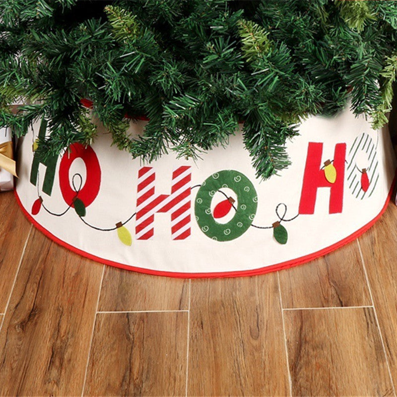 Creative lettering Christmas tree skirt covering tree stand base