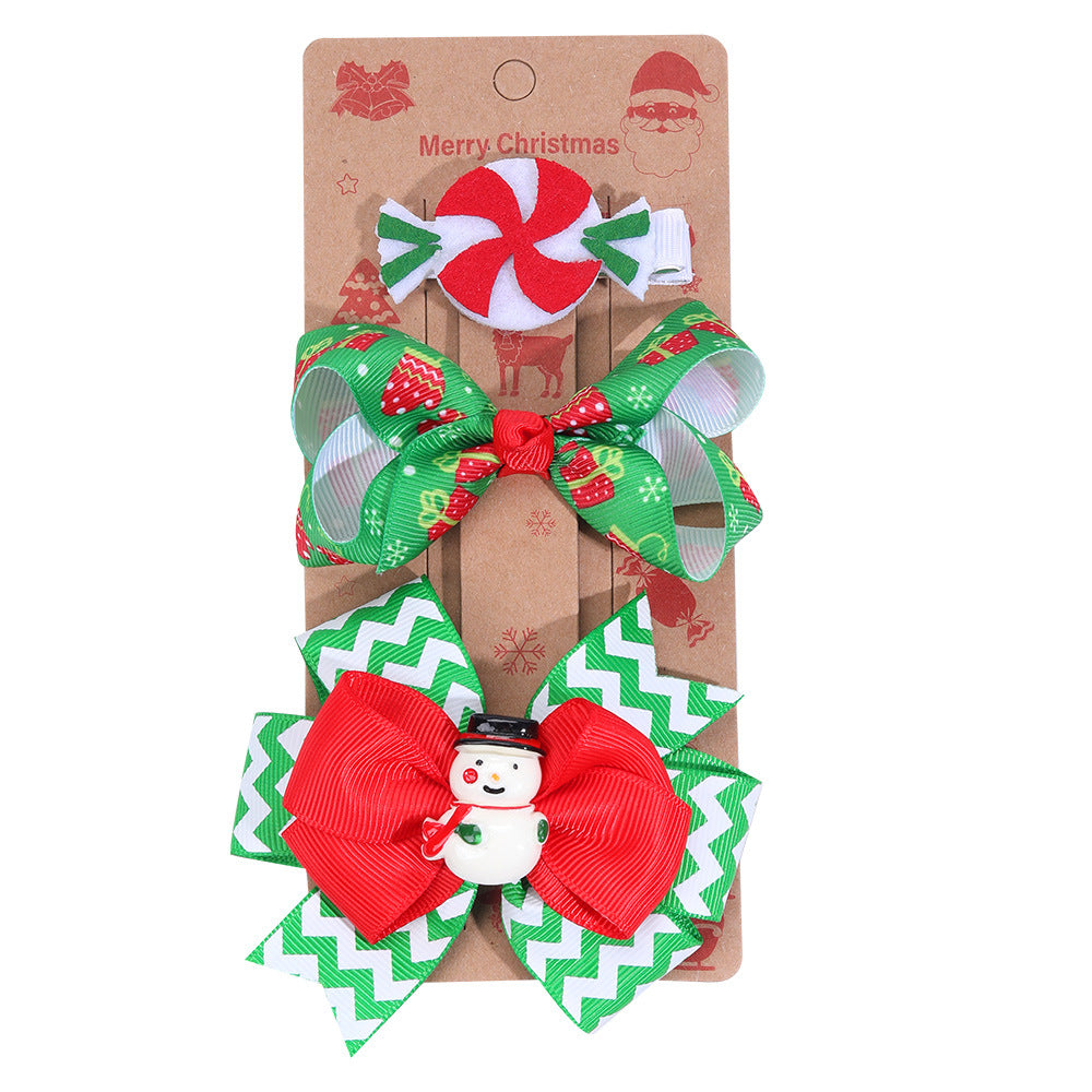 Christmas bow hairpins in multiple colors laid out for viewing