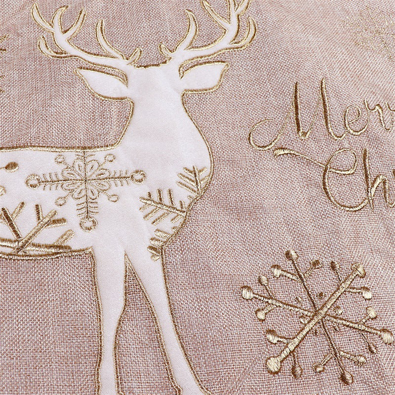 Gold and white linen Christmas tree skirt showcasing traditional holiday elegance