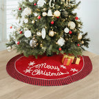 Plush black and red plaid Christmas tree skirt draped around a decorated holiday tree