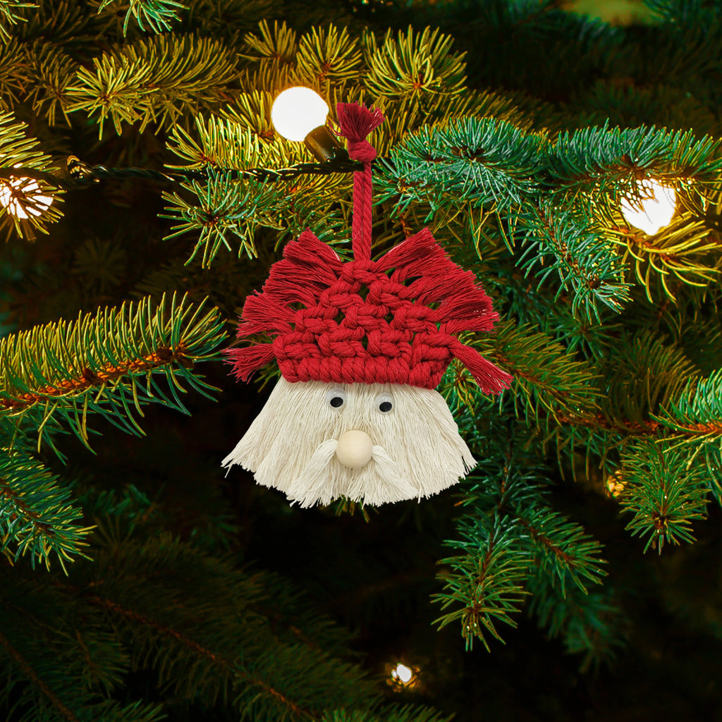 Hand-woven Christmas tree pendant displayed as holiday decor