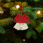 Hand-woven Christmas tree pendant displayed as holiday decor