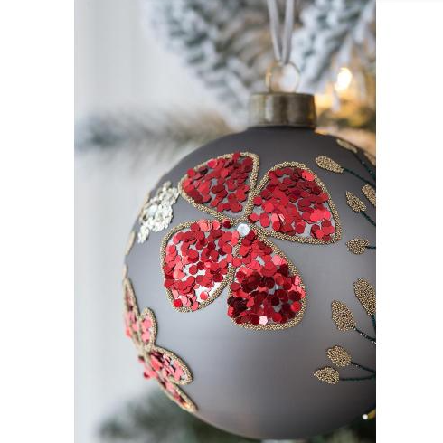 Elegant glass ornament featuring hand-painted design and glitter detail