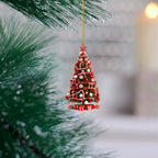 Close-up of flat acrylic Christmas tree pendant charm with clean modern art silhouette