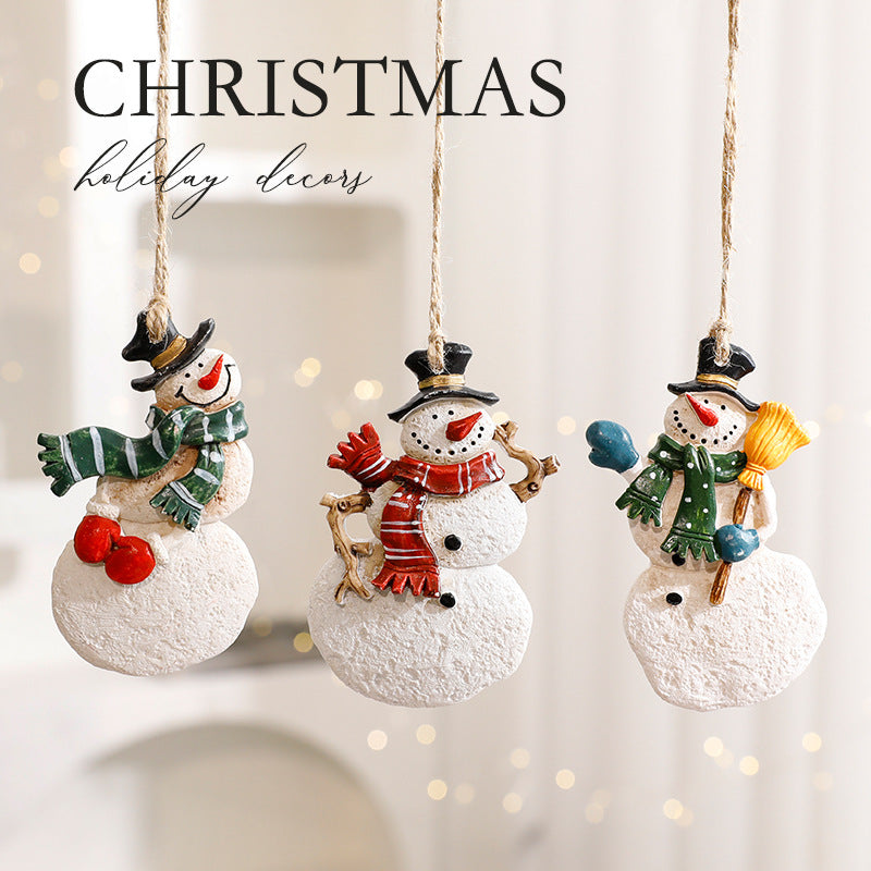Festive elk Christmas ornament positioned among holiday greenery - Christmas decor