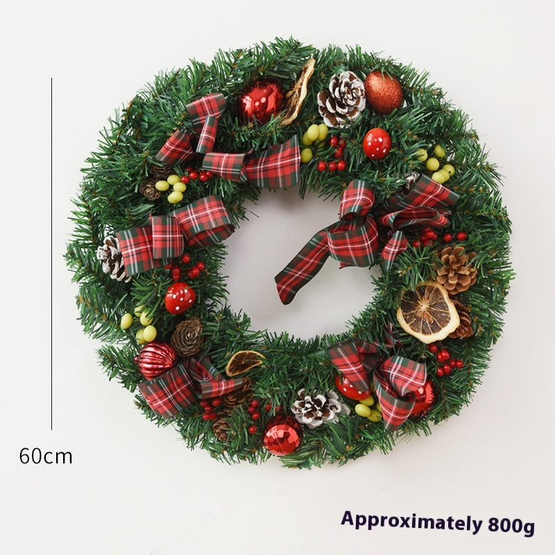 Christmas wreath decoration with garland bow as festive window hanging