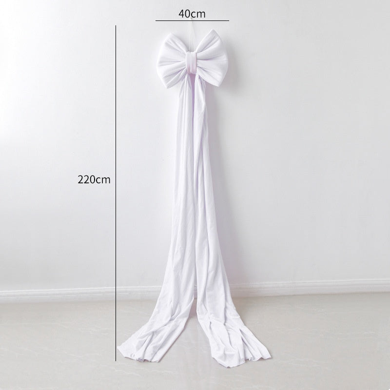 Large decorative bow crafted in velvet fabric for Christmas mantel or tree