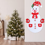 Toddler hands placing felt buttons on snowman body during craft activity