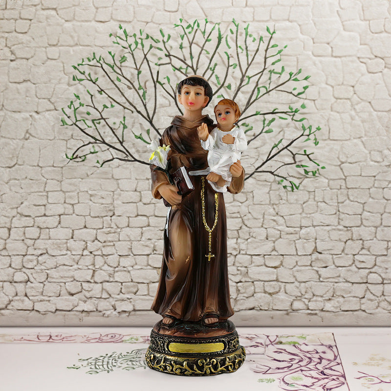 Nativity scene resin figures featuring Virgin Mary holding Baby Jesus