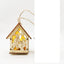 Christmas small house boxwood decorations arranged as holiday table display with warm ambiance