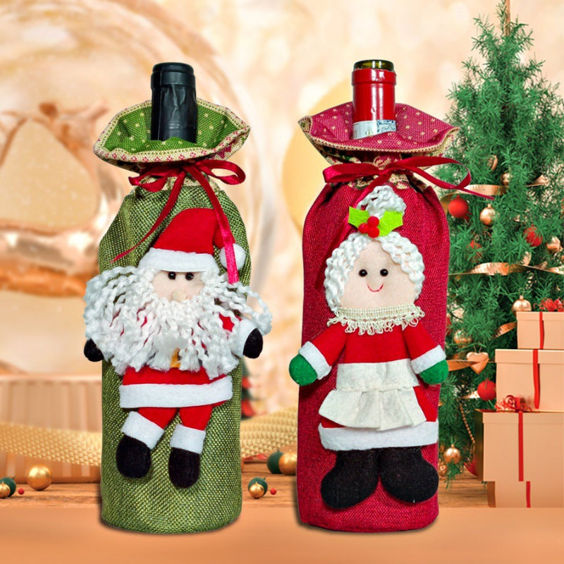 Festive wine bottle covers styled on a holiday table setting