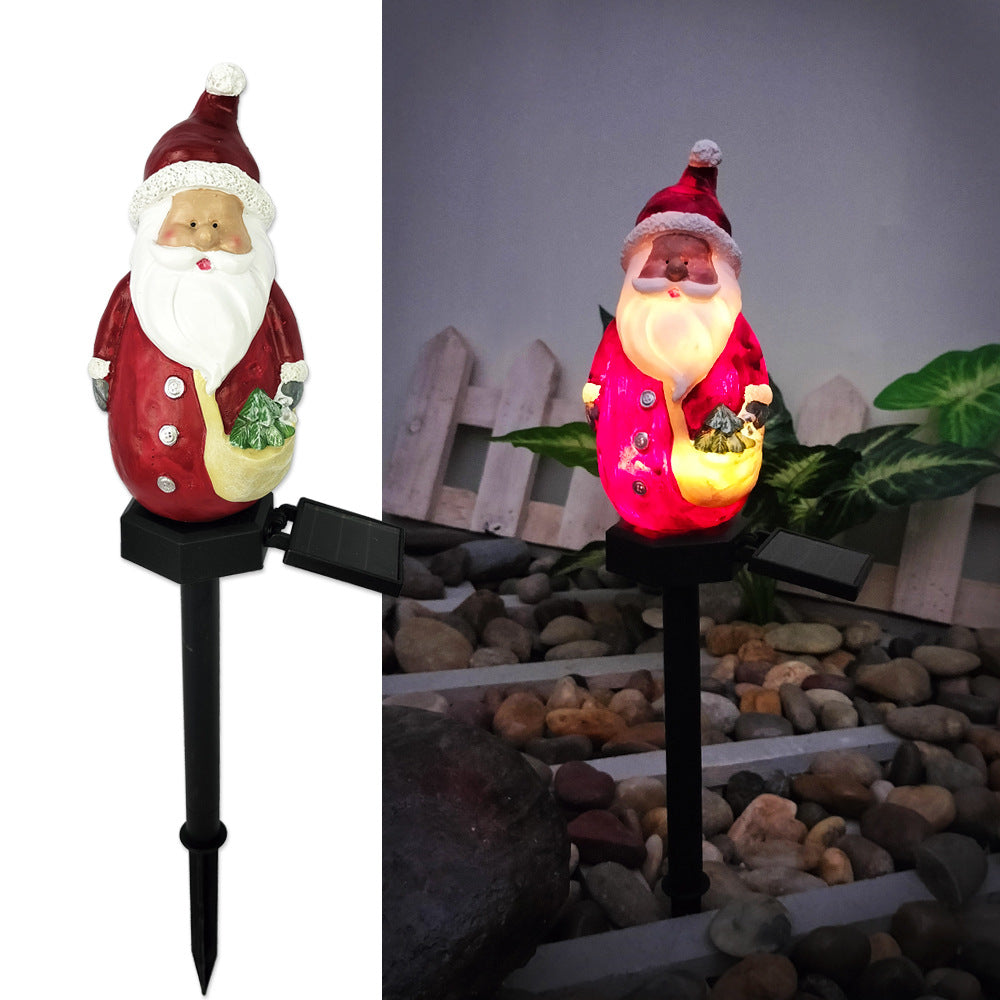 Christmas solar yard lamp glowing warmly in evening setting